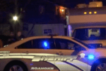 Roanoke, VA sheriff's vehicle with blue lights flashing at night.