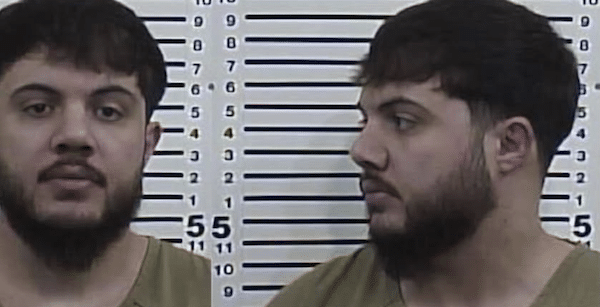 Dual-view mugshot showing a bearded young man facing forward and in profile against a height chart.